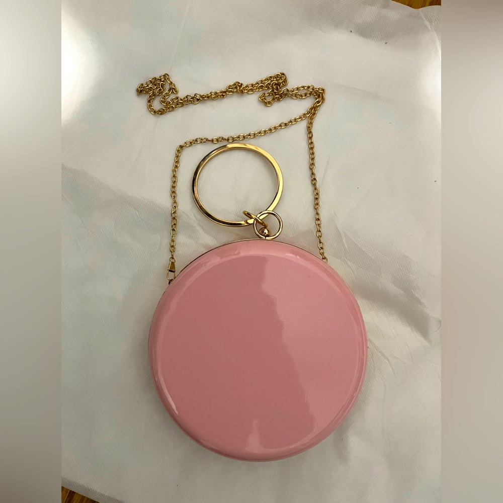 Pink round patient leather round crossbody or clutch